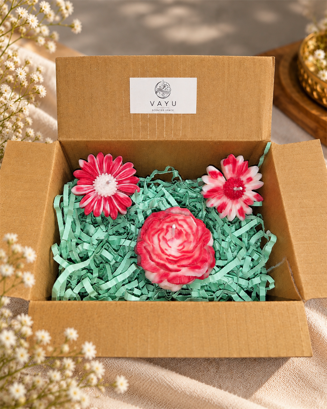 Pink and white rose and daisy candles arranged in a Vayu gift hamper box