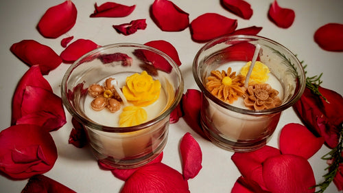 Buttercup candle, yellow wax flower set in clear glass
