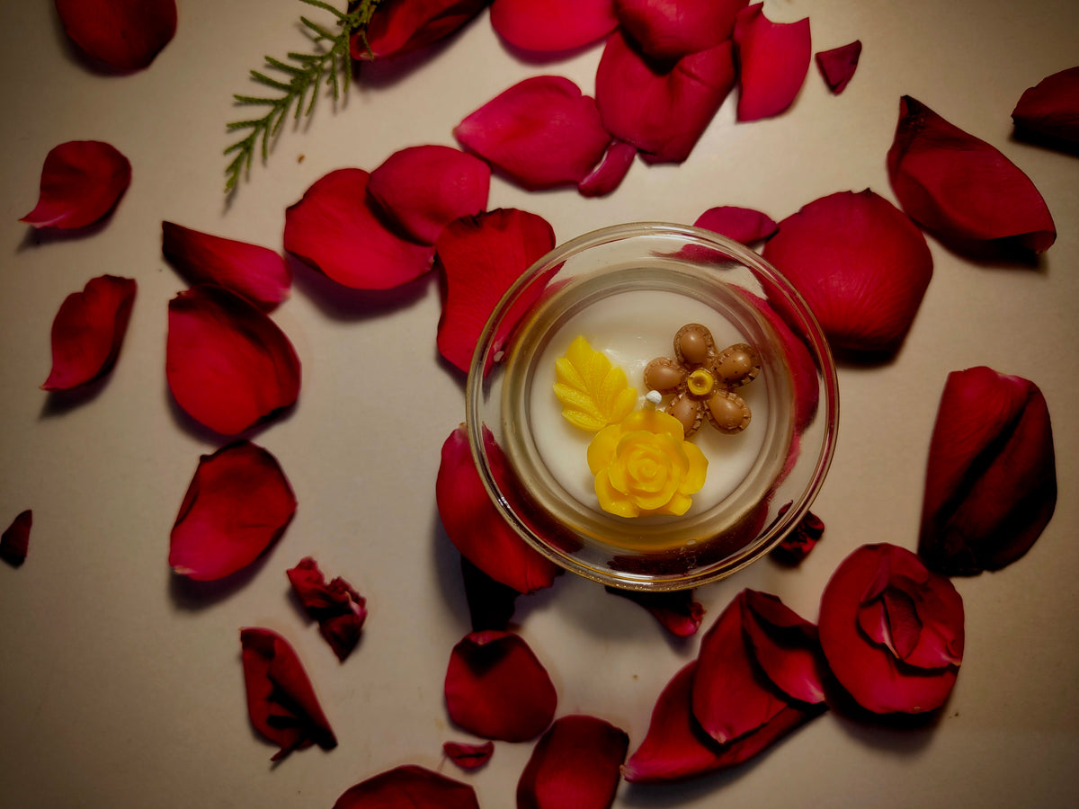 Buttercup candle, yellow wax flower set in clear glass