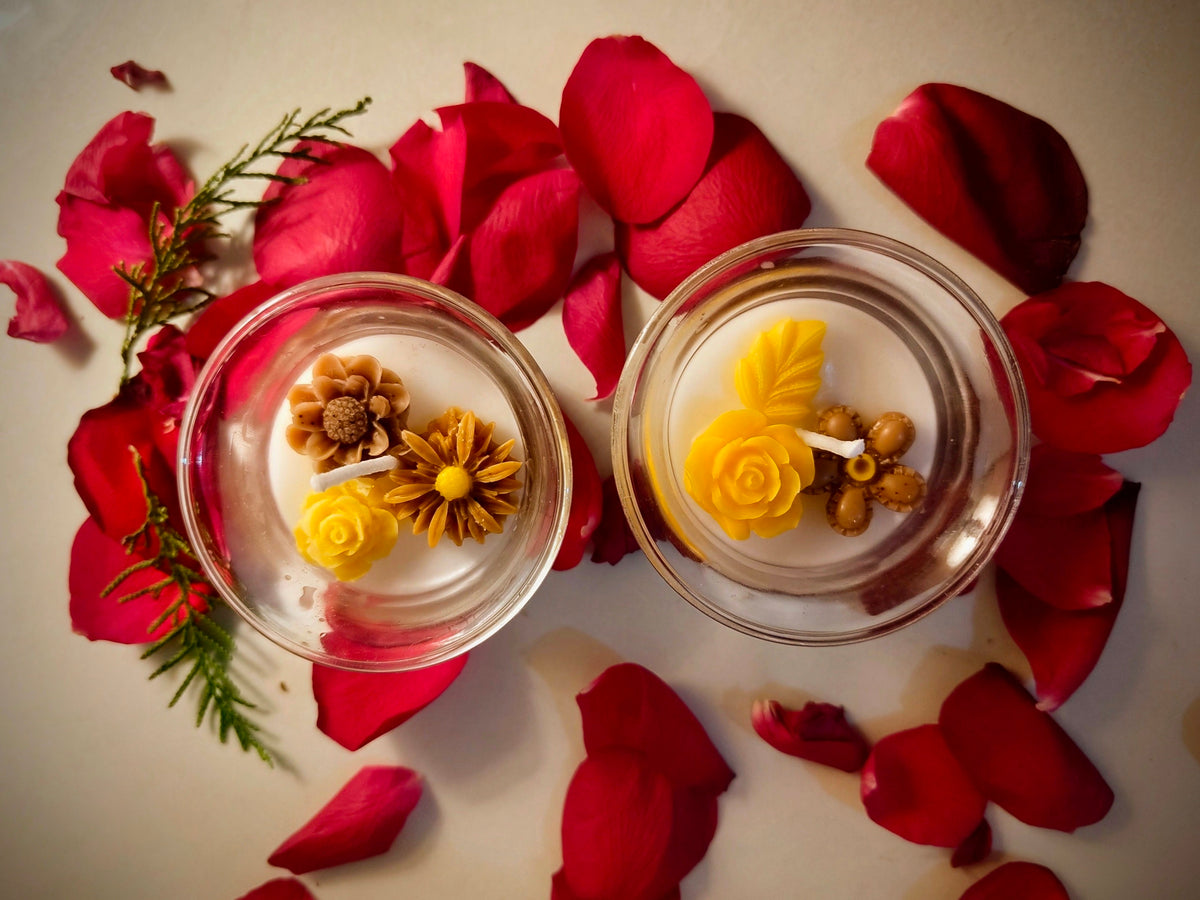 Buttercup candle, yellow wax flower set in clear glass