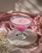 Cocktail candle with pink ombré wax in a stemmed glass